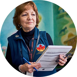 Canadem representitive reviews political documentation